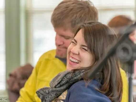 A Woman Laughing With Her Husband, Representing The Type Of Fun Couples Can Expect To Have At One Of A Churches Christian Marriage Retreats | Wcrc