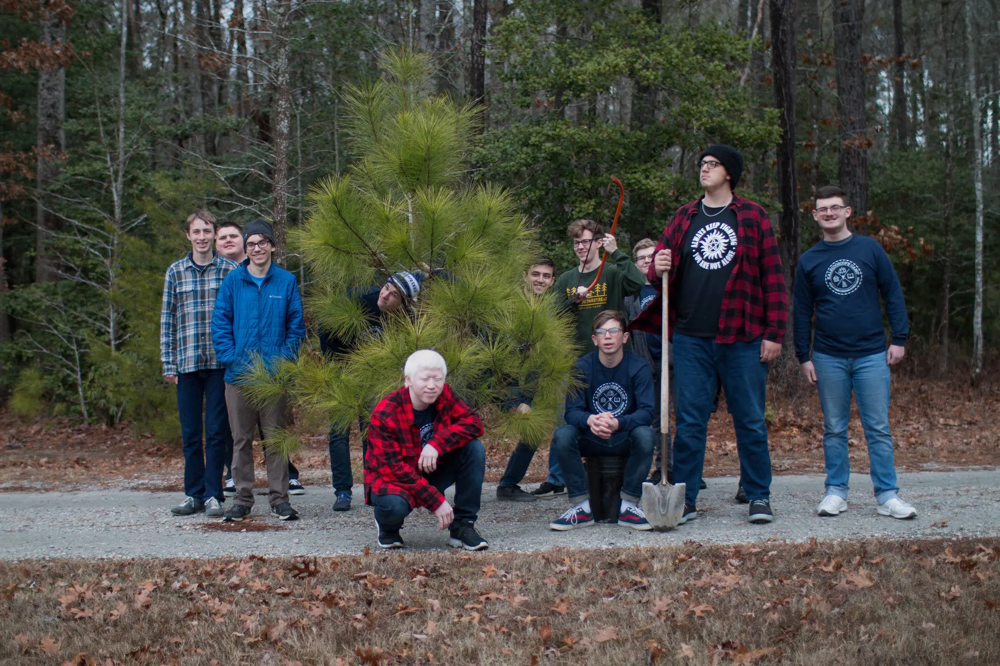 Youth At Winter Camp Around Tree