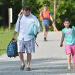 Father Dropping Child Of At A Christian Overnight Summer Camp