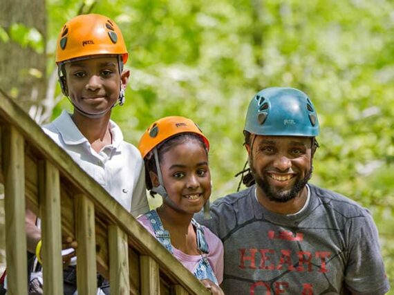 A Christian Family Preparing To Ride The Ziplines At Wcrc While On A Family Getaway.