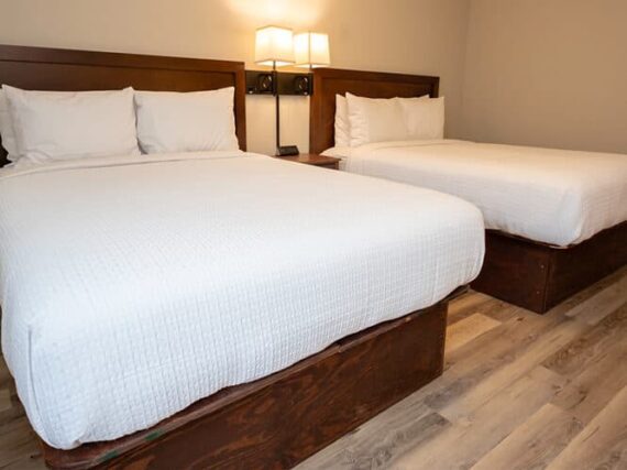 A Look Inside One Of The Family Getaway Lodging Options At Wcrc, Complete With Comfortable Full-Sized Mattresses.