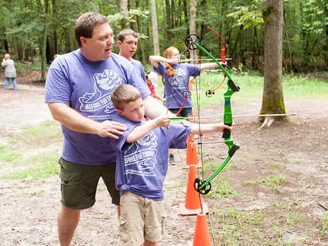 How To Choose A Family Reunion Venue 3 Father And Son At The Archery Range, One Of The Fun Camp Offerings Available At Wcrc Christian Summer Camp
