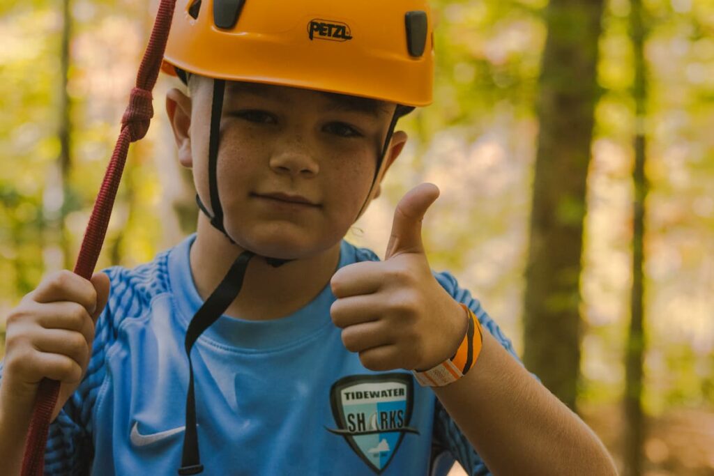 A Boy Enjoying The Ropes Course At Wcrc'S Family Harvest Festival In Williamsburg, Virginia
