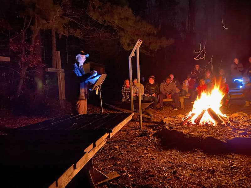 A Pastor Giving A Sermon At Christmas Around The Campfire At Wcrc In Williamsburg, Virginia