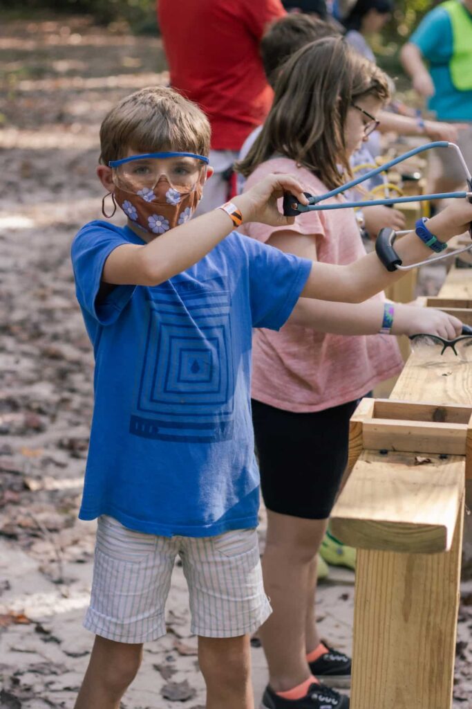 Kids Playing With Sling Shots At Wcrc'S Family Harvest Festival