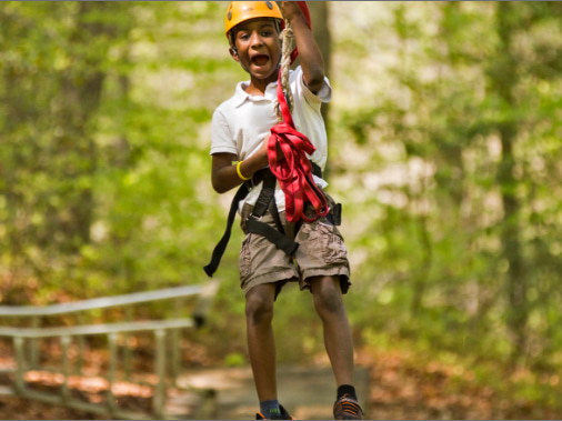 A boy on the zipline course at Williamsburg Christian Retreat Center in Williamsburg, VA